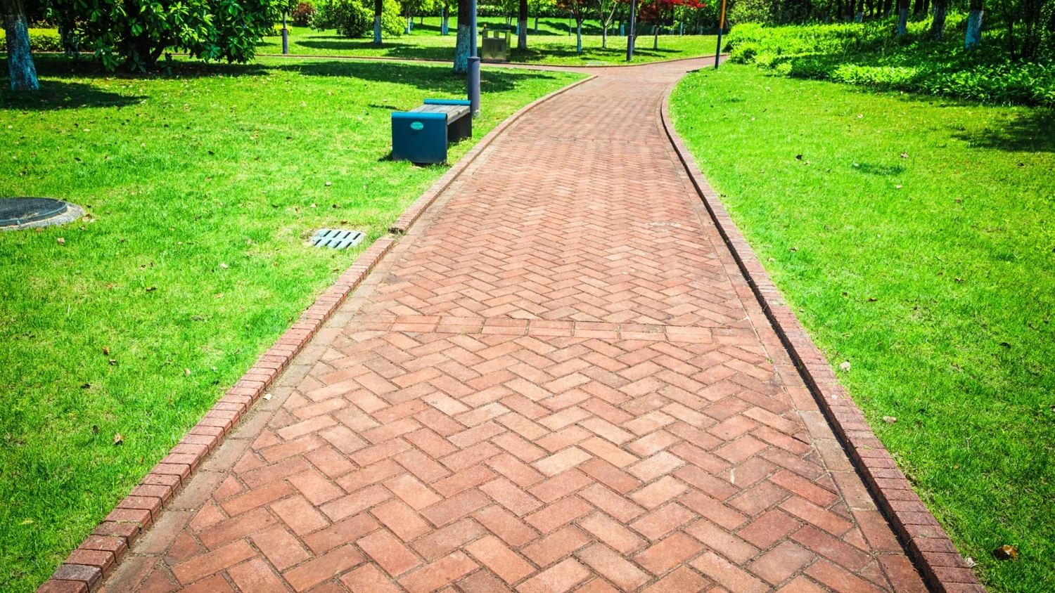 Brick paver walkway through maintained grounds